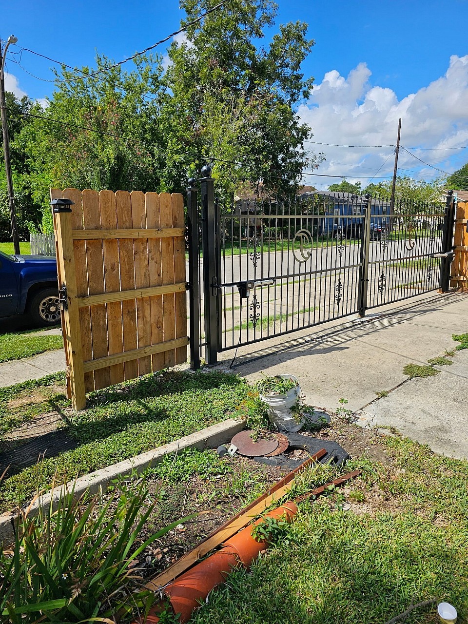 Wooden Fence with Custom Engraved Motorized Gate